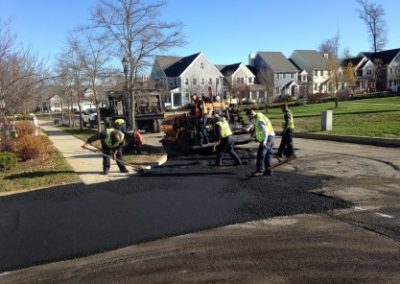 101 Overlay Big Paver With Crew On Corner