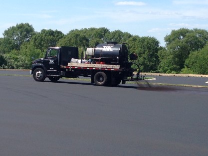 Spraying Half Of Road With Tape In Middle
