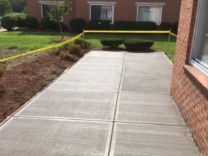 Concrete Area By Brick Building